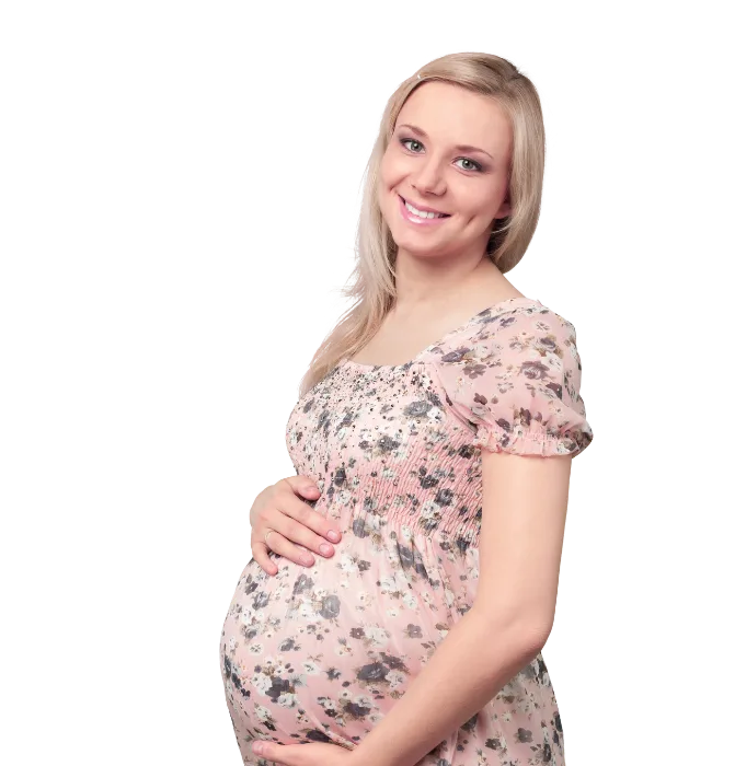 A happy pregnant woman gently holding her belly, symbolizing early motherhood and emotional connection